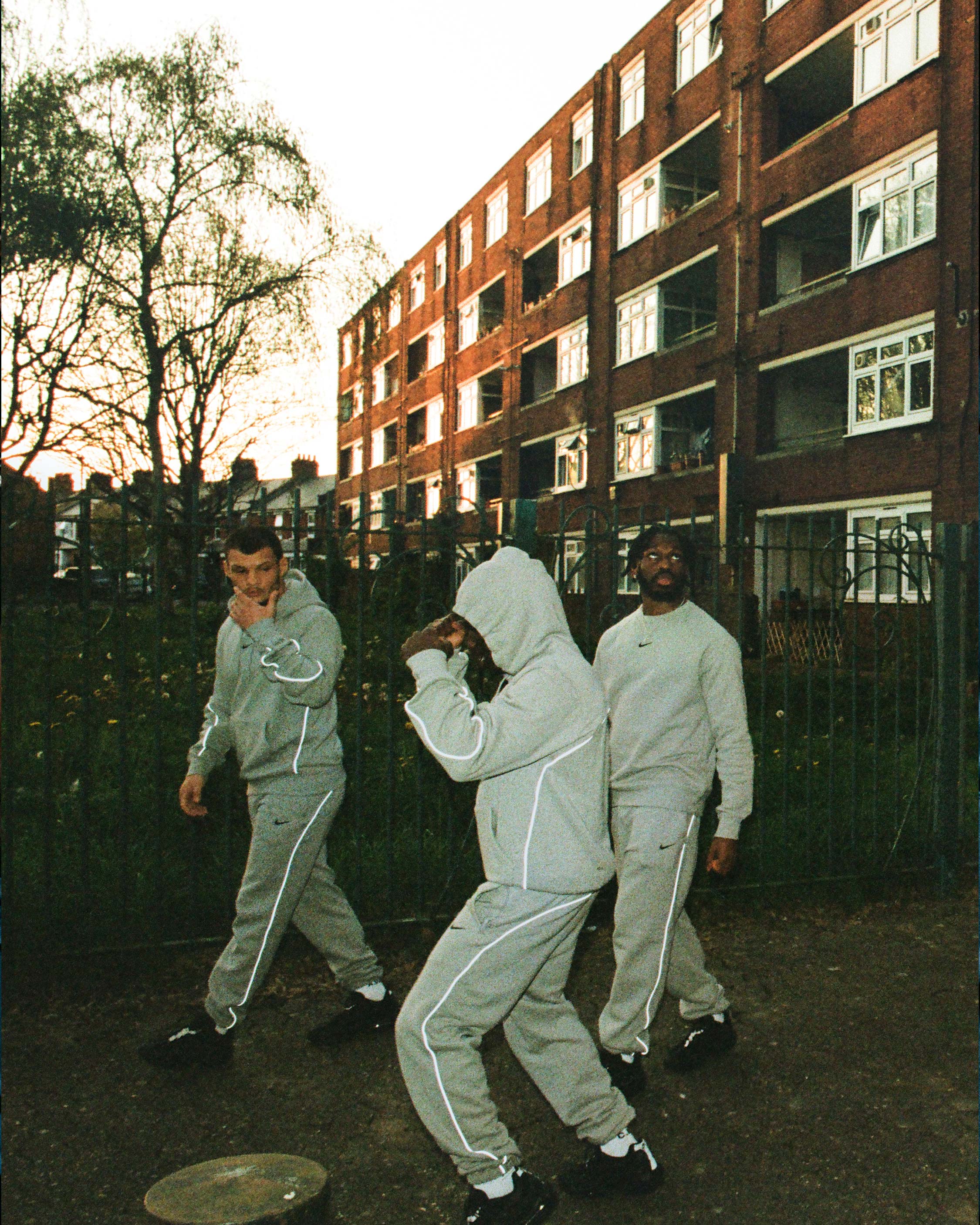 NOCTA athletes in grey tracksuits